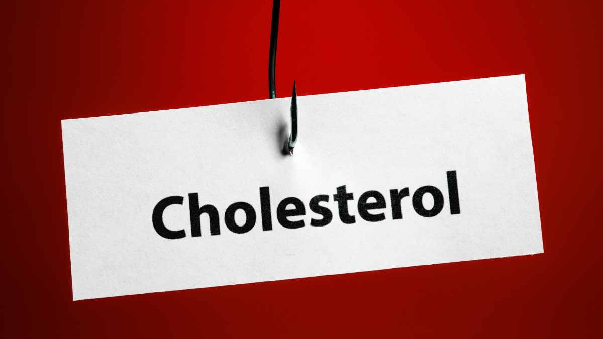 Cholesterol concept image. Hook piercing a cholesterol label
