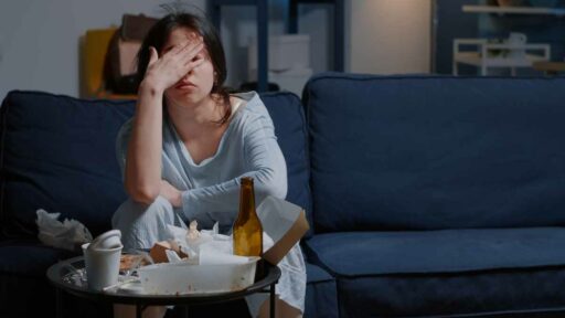 Fatigue - upset young woman massaging forehead bridge
