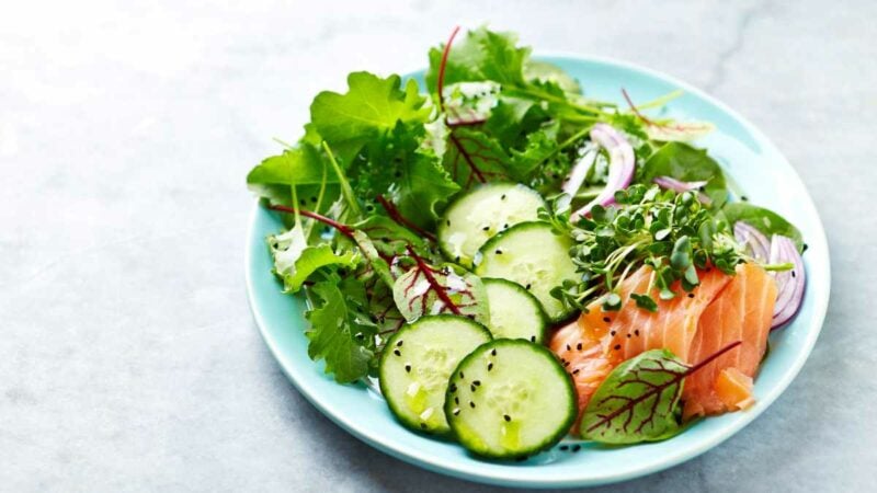 Keto diet meal. mixed salad with fish