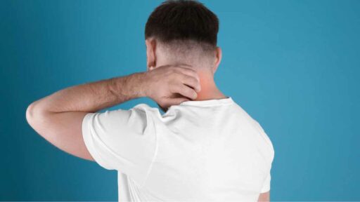 Nickel allergy - man scratching his neck