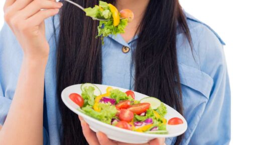 Vegetarian girl showing vegetarian food