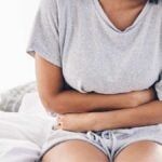 Woman Sick on House Bed for Ibs Crisis
