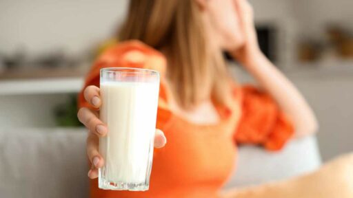 Young Woman with Lactose Intolerance at Home