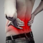 Young man with lower back pain