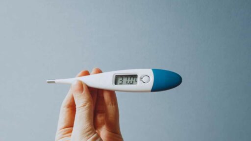digital thermometer showing 37 degrees fever