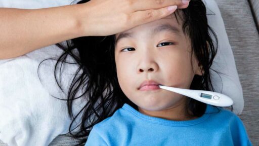 fever measurement for a young girl